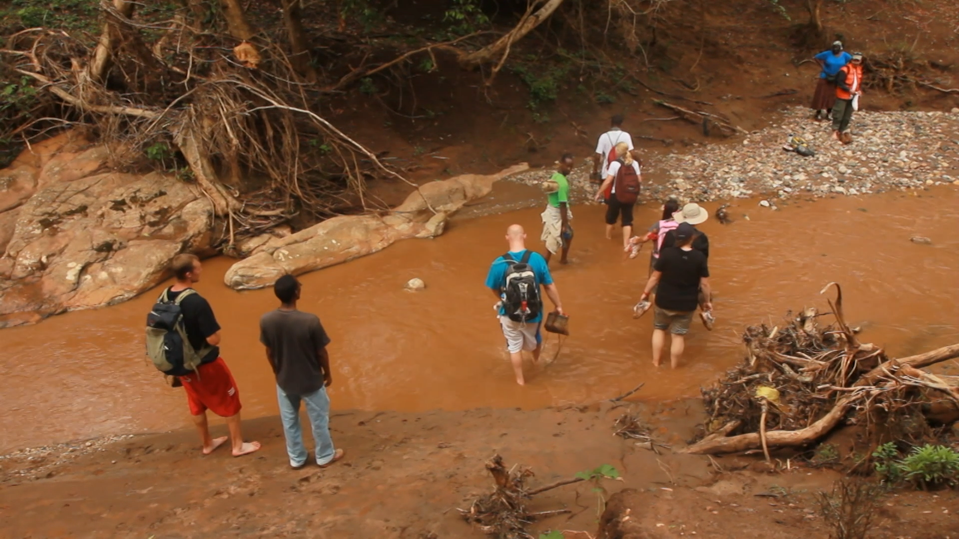 People crossing a stream.
